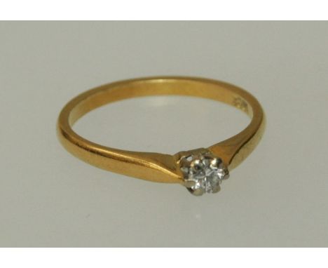 A single stone diamond ring, approx 1/8 carat, claw mounted to 18 carat gold shank, size L, gross weight 2gm