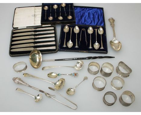 A cased set of six silver, bean terminal coffee spoons, six silver handled tea knives, toddy ladle, a cased set of EP teaspoo