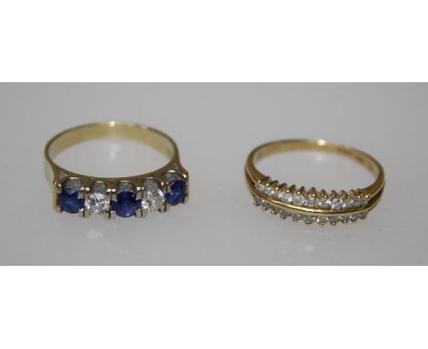 An 18k sapphire and diamond ring, channel set three blue sapphires alternated with two round brilliant cut diamonds, stamped 