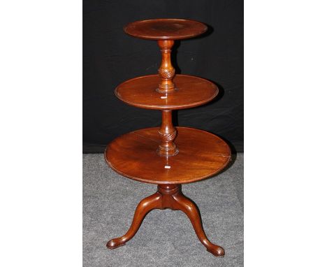 A George III mahogany three tier dummy waiter, the staggered tiers laid on a tripod base and pad feet. One tier cracked. Heig