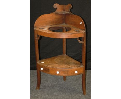 A late George III oak corner washstand, later fitted with ceramic knop handles, 104 x 60cm