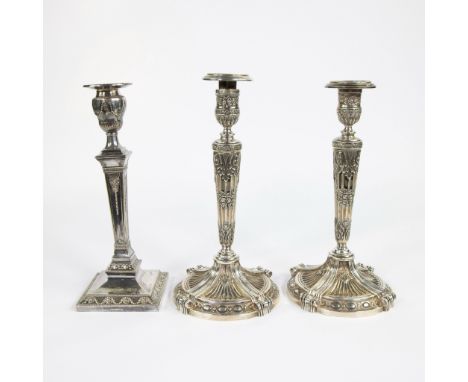 Pair silver 800 candlesticks Belgium late 19th century, 1700 grams and one silvered English candlestickKoppen zilveren kandel