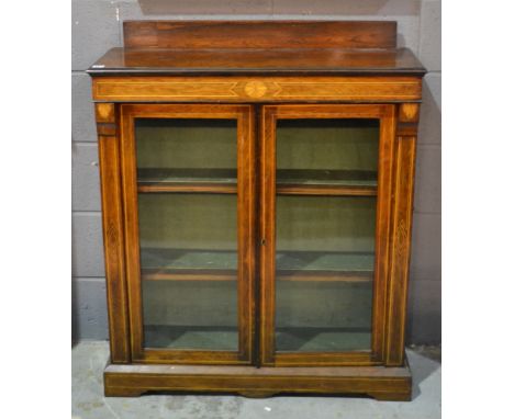 A late Victorian inlaid rosewood display cabinet, with glazed double doors on bracket plinth base, width 91cm