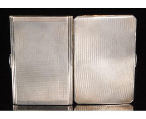 Two hallmarked silver rectangular cigarette cases, each with engine turned decoration, both engraved to the interior, Birming
