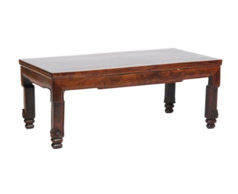 A Chinese hardwood table of rectangular form, possibly an altar table, raised to scroll carved feet, height 35cm, width 88cm 