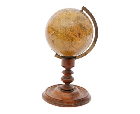 An early 19th Century Newton's desk globe, diameter 7cm, supported in a brass arc on turned pedestal and circular base, heigh