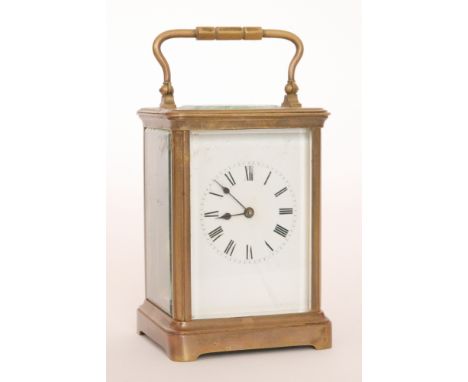A late 19th Century French brass carriage clock with white enamelled dial, the pillared movement striking on a gong, height 1