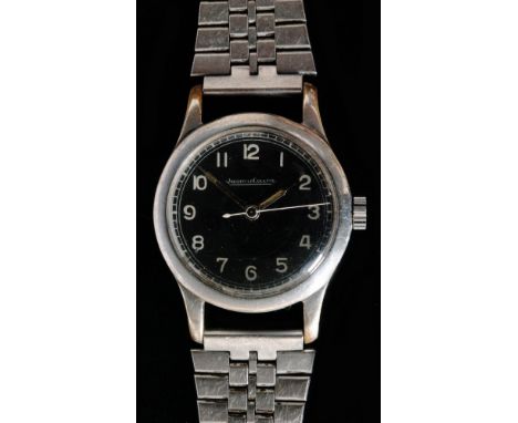 A military issue Jaeger LeCoultre manual wind wrist watch, white Arabic numerals to a black enamelled dial, case numbered 6B/
