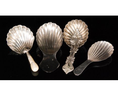 A Victorian shell bowl caddy spoon with turned mother of pearl handle, Birmingham 1865 George Unite, together with a another 