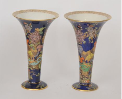 A pair of Carlton Ware Cock and Peony trumpet vases with gilt and enamel decoration against a blue ground, printed marks, hei