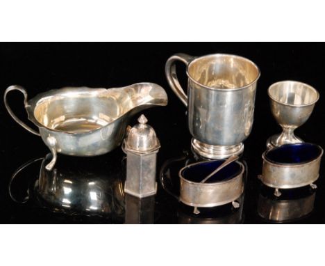 Two hallmarked silver cigarette cases, each with engine turned decoration, one engraved with a dog, together with three silve
