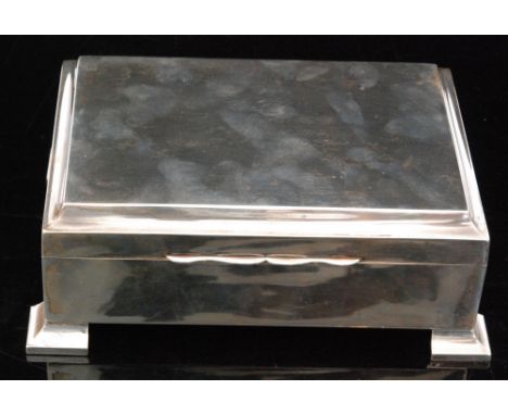 A hallmarked silver rectangular jewellery box, of plain form with engraved dedication to the lid, the lid opening to reveal a