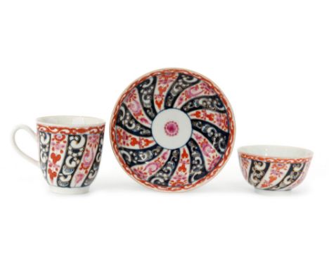 An 18th Century Worcester Queen Charlotte pattern trio comprising tea bowl, coffee cup and saucer each decorated with a pink 
