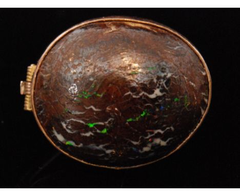 An early 20th Century 9ct rose gold mounted oval cabochon boulder opal brooch, length 3cm. 