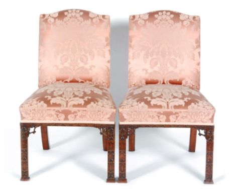 A late 20th Century Chinese Chippendale style mahogany fold over card table on square block legs and carved corner brackets, 