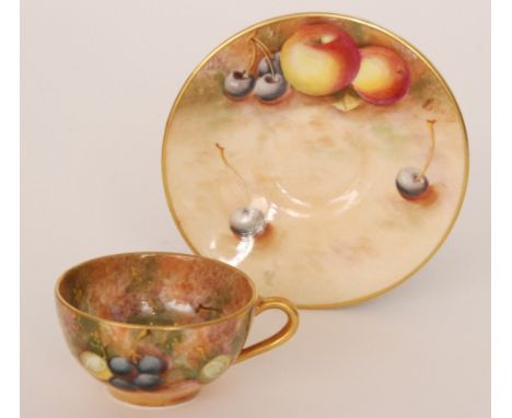 A Royal Worcester Fallen Fruits cabinet cup and saucer hand painted by Roberts, the cup with peaches and grapes to the interi