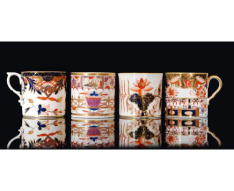 Three early 19th Century Spode Bute shape coffee cans, the first decorated in pattern 498 with an upper band of birds and fol