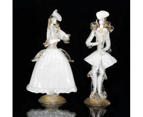 A pair of early 20th Century Murano glass figures in the form of a male and female in opal cased in clear crystal all to wryt