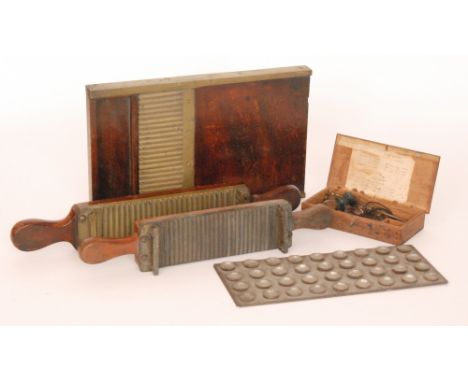 A late 19th to early 20th Century brass mounted mahogany pill making machine, a similar example lacking base together with a 