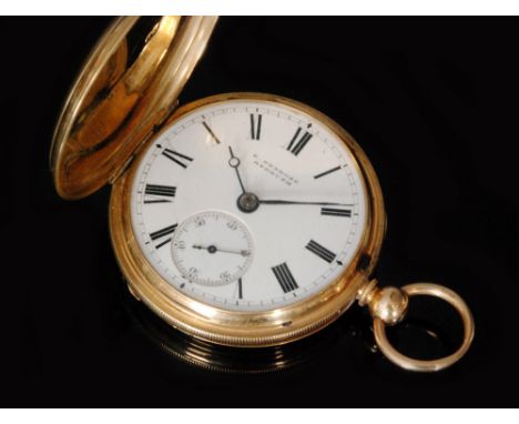 An 18ct hallmarked key wind full hunter pocket watch with engine turned decoration to whole, Roman numerals to a white enamel