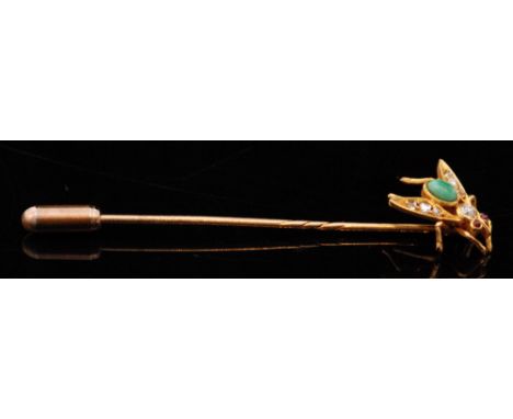 A 20th Century bug stick pin, with cabochon oval malachite body, diamond set wings and ruby eyes, unmarked.  