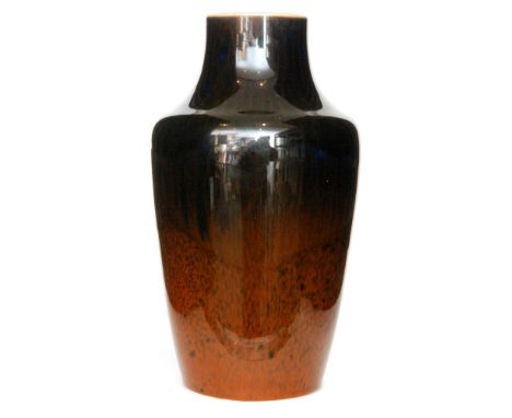 A Ruskin Pottery souffle glaze vase of high shouldered form glazed in a tonal brown with dark streaking over the lighter grou