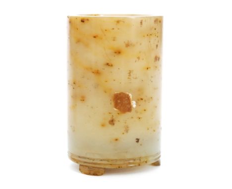 A late 19th to early 20th Century Chinese mottled jade brush pot of plain cylindrical form with incised rings to the base abo