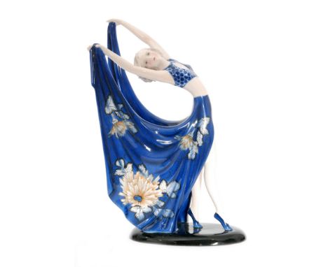 A 1930s Art Deco Goldscheider figure designed by Stephan Dakon, modelled as a posing dancing lady dressed in a blue spotted t