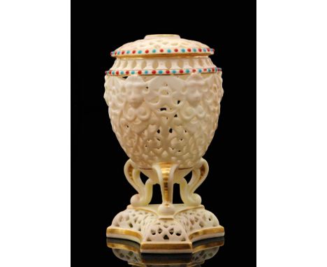 A Grainger, Worcester Royal China Works reticulated vase and cover, the egg shaped body raised to three scroll feet on a pede