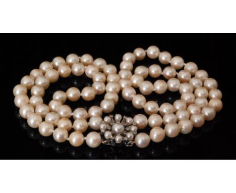 A double row of uniform cultured pearls terminating in 14ct diamond and pearl set snap, each bead diameter approximately 8.8m