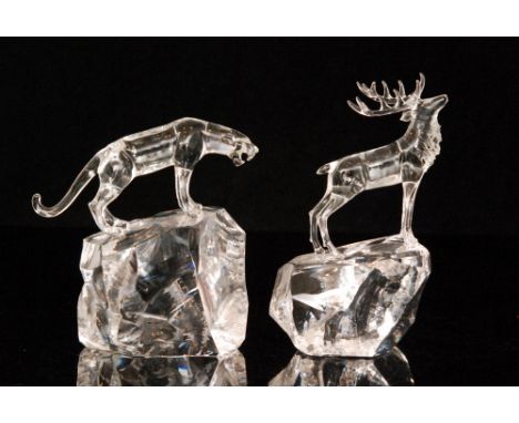 A contemporary studio glass figure of a panther in lamp worked in clear crystal  by Neil Harris mounted to a facet rock, toge