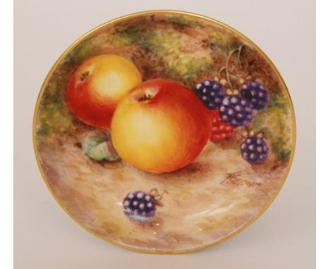 A Royal Worcester Fallen Fruits pin dish coaster decorated by Freeman with hand painted apples and berries, signed, black pri