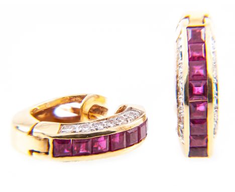 A pair of ruby and diamond half hoop earrings and a ruby cross, eight square cut rubies channel set with seven brilliant cut 