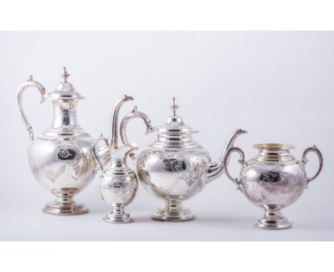 A Victorian silver four-piece teaset, by Henry Wilkinson, London 1877, each piece of vase shape, with brightcut engraved foli