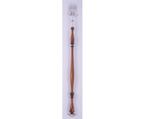 An Edwardian silver and fruitwood toasting fork, by Thomas Bradbury & Son, Sheffield 1908, pierced and engraved blade, slende