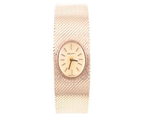 Zenith -  A lady's 9 carat yellow gold bracelet watch, having an oval champagne baton dial, in a 9 carat yellow gold case in 