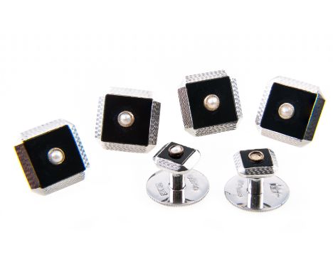 A cased set of 9 carat white gold dress studs, comprising four dress studs and two collar studs all having a square black ony