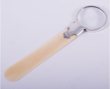 A silver and ivory letter knife/magnifier, by Crisford & Norris, Birmingham 1917, circular lens, 20cm.This lot is subject to 