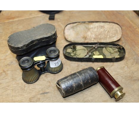 A pair of opera glasses, a telescope and a set of scales 