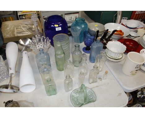 A collection of coloured glass vases; a decanter; various old glass bottles etc. 
