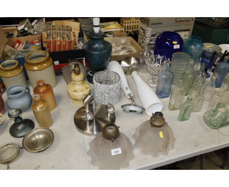 A table lamp and a collection of various light fittings and shades 