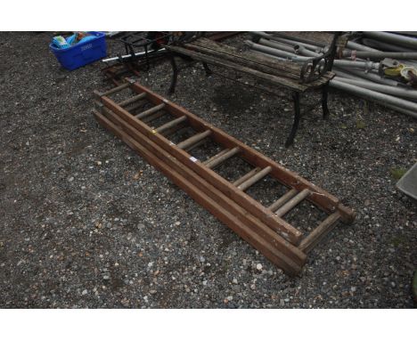 A wooden extending ladder