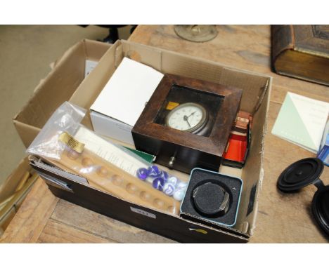 A box of decorative wooden items including a puzzle box, a gimbled clock, a small clock, a watch, a cribbage set and two wood