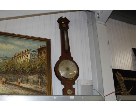 A Negretti & Zambra of London oak cased barometer