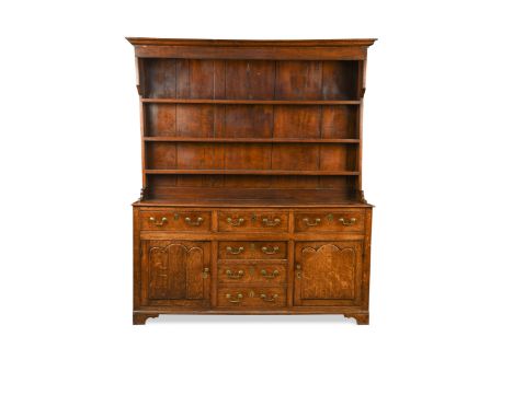 with associated three tier boarded plate rack, above drawers and side cupboards, period brasses, on bracket feet (Dimensions: