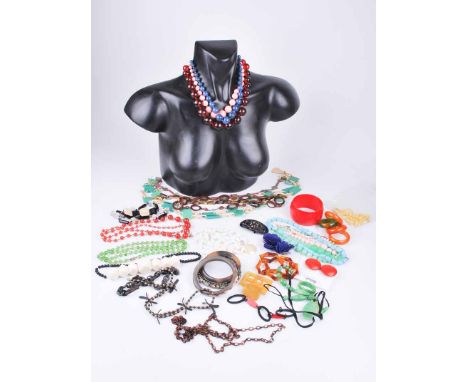 A collection of 1930s, 50s and 60s costume jewellery to include bangles, simulated jade, Peking glass, clip earrings and more