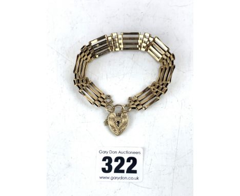 9k gold gate bracelet with heart lock, 7" long, w: 16 gms