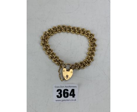 9k gold gate bracelet with heart lock, 7" long, w: 13.4 gms