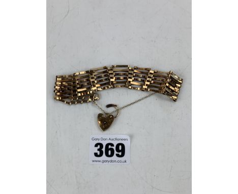 9k gold gate bracelet with heart lock, 8" long, total w: 12.2 gms