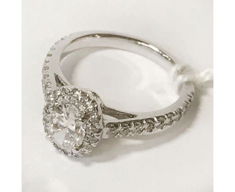 OVAL SHAPED DIAMOND PLATINUM RING CENTRE STONE IS 0.70 CT - TOTAL DIAMOND CONTENT 1.00 CT - SIZE K-L